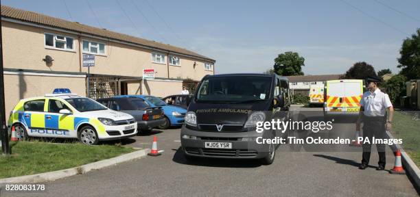 Private ambulance removes two bodies from Laburnum Close, Ambrosden, Tuesday August 30 2005. Police investigating the deaths of three people involved...