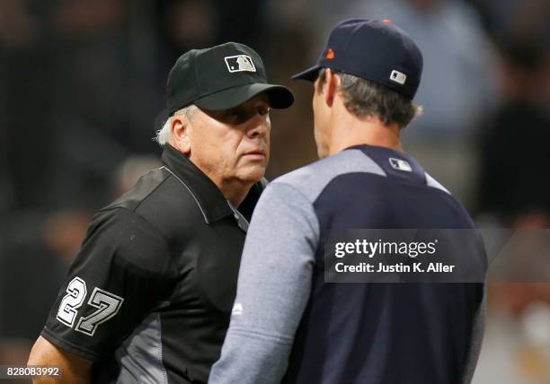Brad Ausmus of the Detroit Tigers talks with umpire Larry Vanover during interleague play against the Pittsburgh Pirates at PNC Park on August 7,...