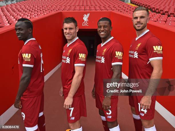 For the Launch of the Western Union partnership Sadio Mane, James Milner, Georginio Wijnaldum and Jordan Henderson of Liverpool wear the shirts with...