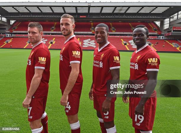 For the Launch of the Western Union partnership James Milner, Jordan Henderson, Georginio Wijnaldum and Sadio Mane of Liverpool wear the shirts with...