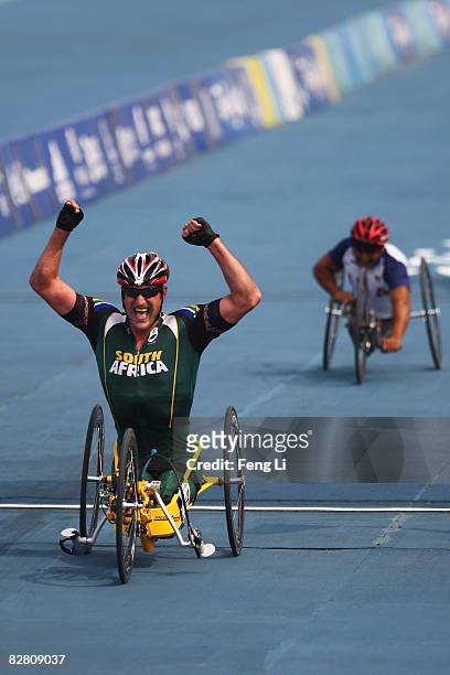 Ernst Van Dyk of South Africa celebrates after winning the Gold in the Road Cycling Men's Road Race at the Triathlon Venue during day eight of the...