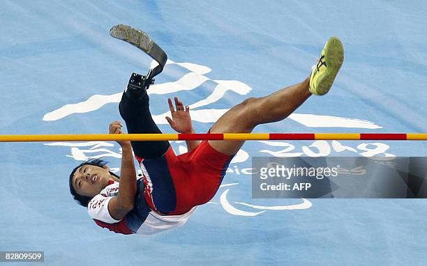 Toru Suzuki of Japan clears the bar during the final of the men's high jump F44/46 classification event at the 2008 Beijing Paralympic Games in...