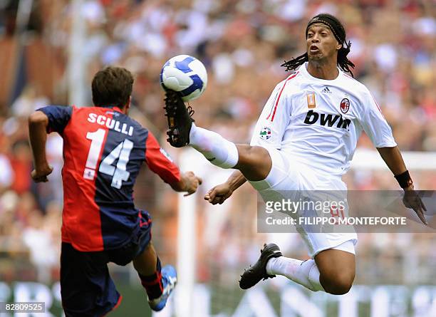 Milan's forward Ronaldinho fights for the ball with Genoa's forward Giuseppe Sculli during their Serie A football match at Genoa's Luigi Ferraris...