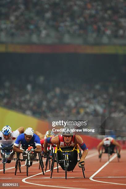 Marcel Hug of Switzerland leads the pack during round one of the Men's 1500M -T54 Athletics event at the National Stadium during day eight of the...