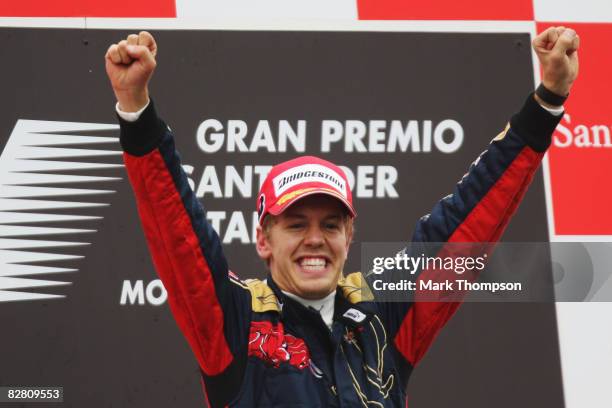 Sebastian Vettel of Germany and Scuderia Toro Rosso celebrates on the podium after winning the Italian Formula One Grand Prix at the Autodromo...