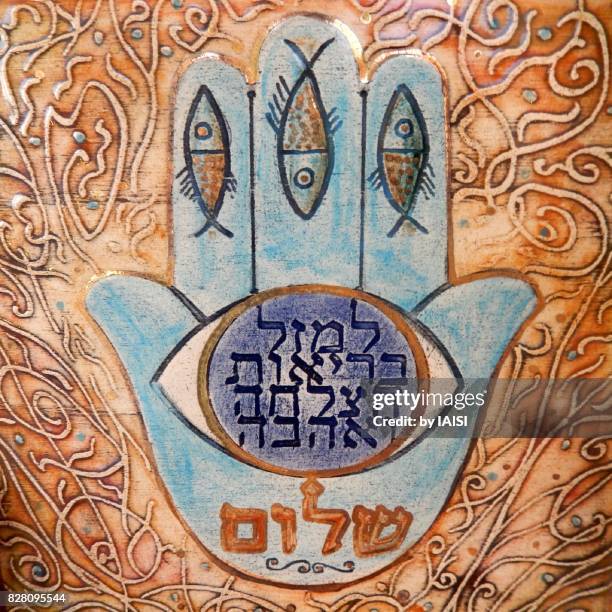 the hamsa, with fishes and blessings in hebrew - hamsa stock pictures, royalty-free photos & images