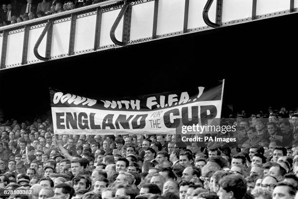 Liverpudlian England fans in the crowd express their displeasure with FIFA after the governing body switched England's semi final match from Goodison...