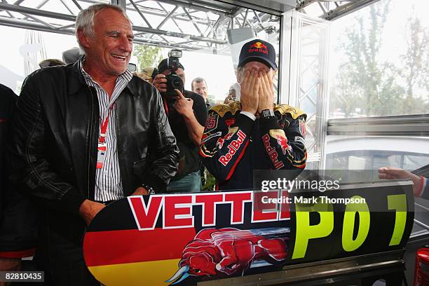 Sebastian Vettel of Germany and Scuderia Toro Rosso celebrates with Red Bull tycoon Dieter Mateschitz in the paddock after winning the Italian...