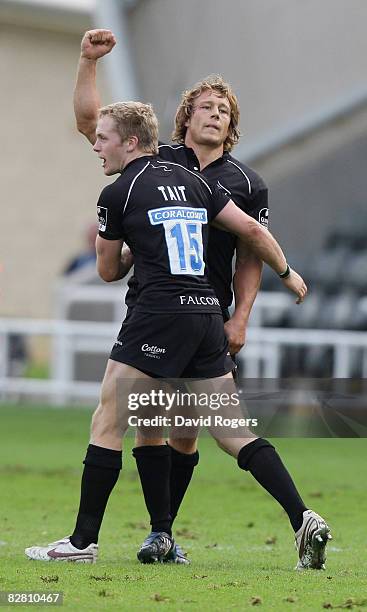 Jonny Wilkinson, the Newcastle standoff , celebrates his last minute match winning drop goal with teammate Alex Tait during the Guinness Premiership...