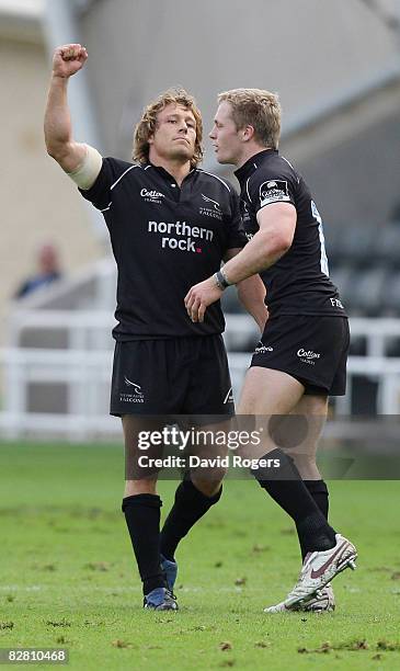 Jonny Wilkinson, the Newcastle standoff , celebrates his last minute match winning drop goal with teammate Alex Tait during the Guinness Premiership...