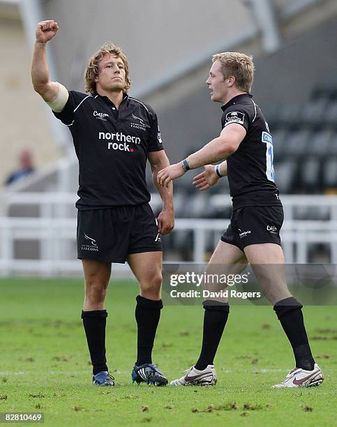 Jonny Wilkinson, the Newcastle standoff , celebrates his last minute match winning drop goal with teammate Alex Tait during the Guinness Premiership...