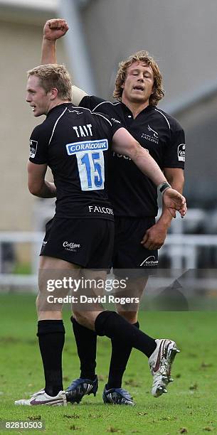 Jonny Wilkinson, the Newcastle standoff celebrates his last minute match winning drop goal with Alex Tait during the Guinness Premiership match...