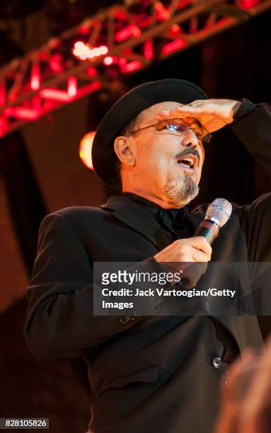 Panamanian musician, actor, and politician Ruben Blades performs onstage at Damrosch Park Bandshell, at Lincoln Center Out of Doors, New York, New...