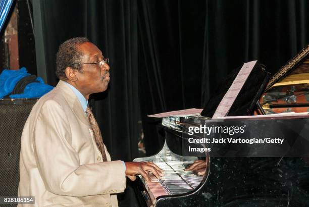 American Jazz musician John Hicks plays piano as he performs with the Ronnie Ben-Hur Sextet during the 2006 JVC Jazz Festival Press Conference at the...
