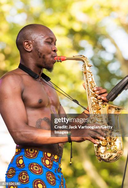 Nigerian musician Seun Kuti plays alto saxophone as he leads his group Egypt 80 during a performance at Central Park SummerStage, New York, New York,...