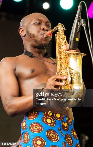 Nigerian musician Seun Kuti plays alto saxophone as he leads his group Egypt 80 during a performance at Central Park SummerStage, New York, New York,...