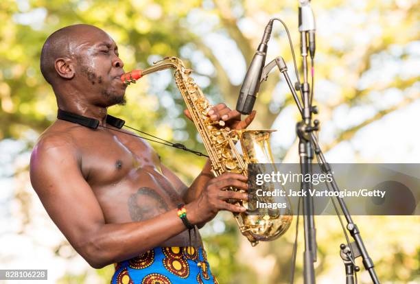 Nigerian musician Seun Kuti plays alto saxophone as he leads his group Egypt 80 during a performance at Central Park SummerStage, New York, New York,...