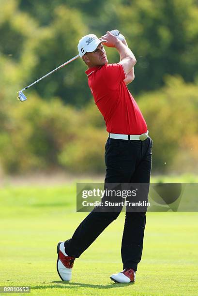 Robert Karlsson of Sweden plays his approach shot on the 12th hole during the final round of The Mercedes-Benz Championship at The Gut Larchenhof...