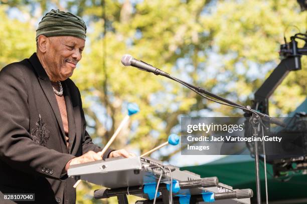 American Jazz musician and band leader Roy Ayers plays vibraphone as he leads his quartet during a performance at Central Park SummerStage, New York,...