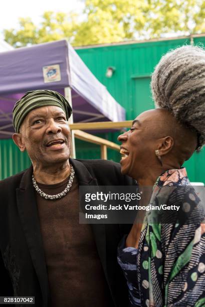 American Jazz musician and band leader Roy Ayers & British-Nigerian singer and actress Wunmi talk backstage at Central Park SummerStage, New York,...