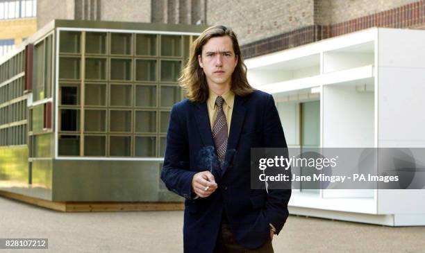 Belgian artist Jan de Cock stands in front of one of his large-scale sculptures which go on display at the Tate Modern for his Level 2 gallery series...