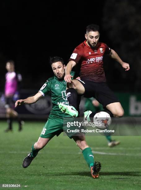 Ersin Kaya of Hume City gets thr ball ahead of Lambros Honos of Bentleigh Greens during the FFA Cup round of 32 match between Hume City FC and...