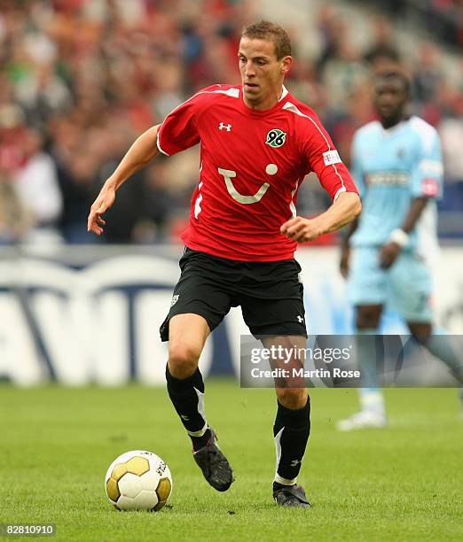 Jan Schlaudraff of Hannover 96 runs with the ball during the Bundesliga match between Hannover 96 and Borussia M'gladbach at the AWD Arena on...