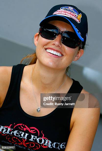 Ashley Force, driver of the Castrol GTX funny car, pauses before being introduced to the fans before the finals for the NHRA Carolinas Nationals at...