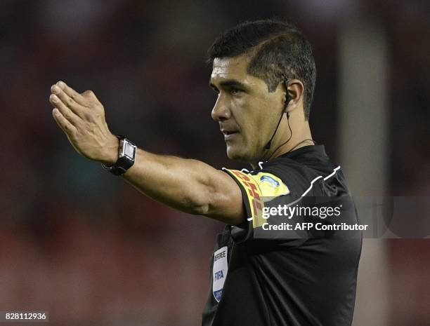 Ecuadorean referee Roddy Zambrano gestures during the Copa Libertadores 2017 round before the quarterfinals second leg football match against...