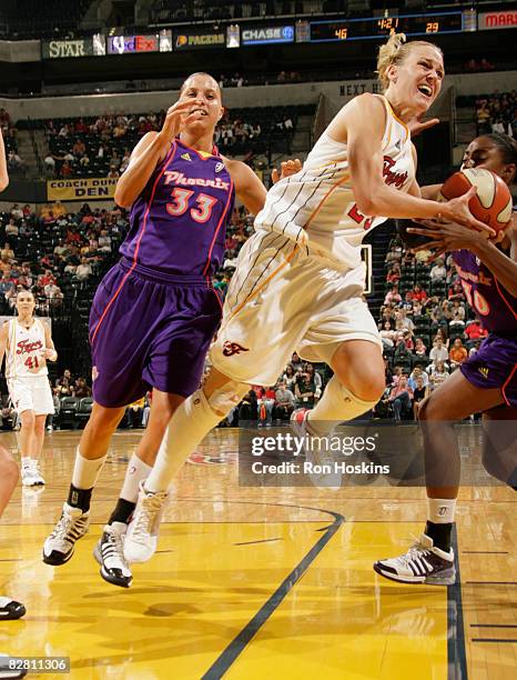 Katie Douglas of the Indiana Fever battles LaToya Pringle and Kelly Mazzante of the Phoenix Mercury at Conseco Fieldhouse September 14, 2008 in...