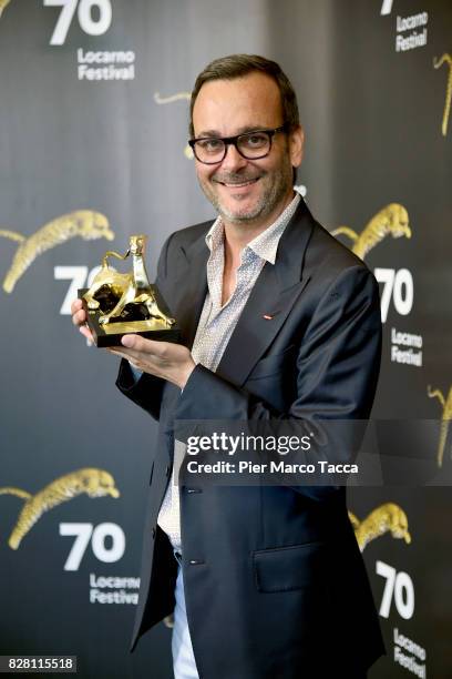 Producer Michel Merkt poses with the Pardo for the Rezzonico Award during the 70th Locarno Film Festival on August 9, 2017 in Locarno, Switzerland.