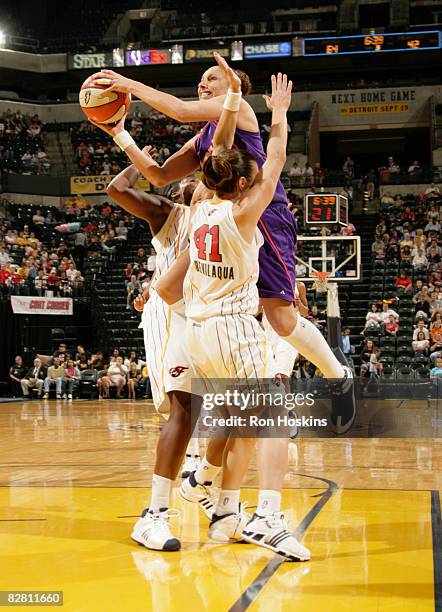 Diana Taurasi of the Phoenix Mercury shoots over Tully Bevilaqua and Ebony Hoffman of the Indiana Fever at Conseco Fieldhouse September 14, 2008 in...