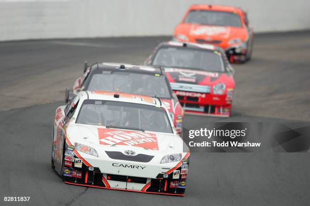 Joey Logano, driver of the Home Depot/DLP HDTV Toyota, drives during the NASCAR Sprint Cup Series Sylvania 300 at New Hampshire Motor Speedway on...