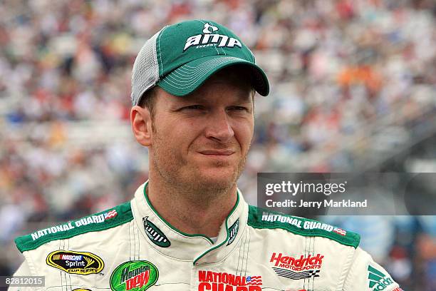 Dale Earnhardt Jr., driver of the AMP Energy/National Guard Chevrolet, stands on the grid prior to the start of the NASCAR Sprint Cup Series Sylvania...
