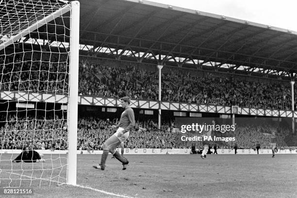 West Germany's Helmut Haller celebrates after scoring the opening goal past USSR goalkeeper Lev Yashin