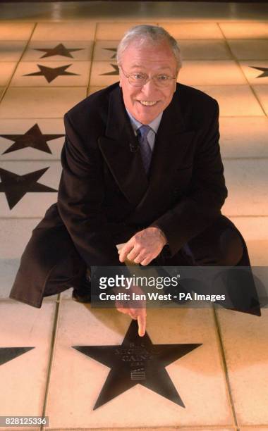 Sir Michael Caine is seen with his star on the newly opened Avenue Of Stars, outside the actors' church, St.Pauls, in Covent Garden, London, which...