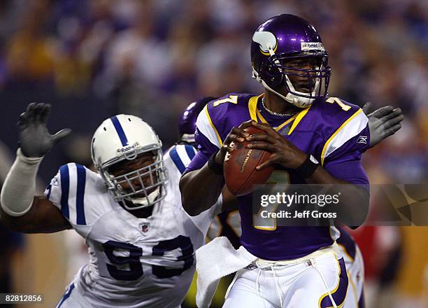 Quarterback Tavaris Jackson of the Minnesota Vikings drops back to pass before being sacked by Dwight Freeney of the Indianapolis Colts in the third...