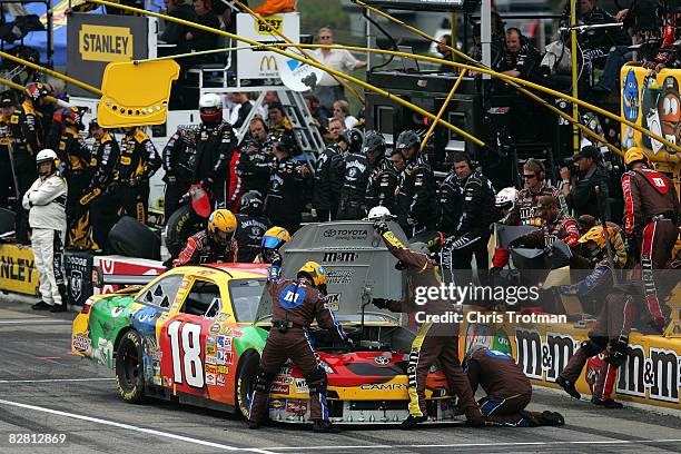 Kyle Busch, driver of the M&M's Toyota, pits during the NASCAR Sprint Cup Series Sylvania 300 at New Hampshire Motor Speedway on September 14, 2008...