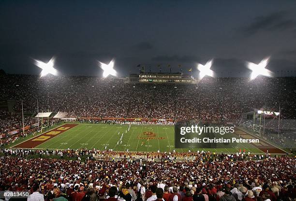 Fans watch the USC Trojans and the Ohio State Buckeyes compete at Los Angeles Memorial Coliseum on September 13, 2008 in Los Angeles, California. The...