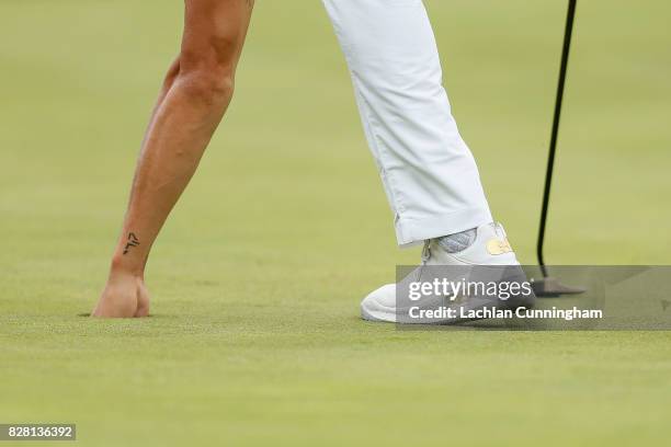 Stephen Curry pulls his ball out of the hole on the fourth green during round two of the Ellie Mae Classic at TCP Stonebrae on August 4, 2017 in...