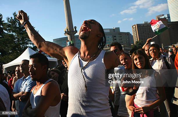 Reveler screams, "Viva Mexico" at a celebration marking Mexican Independence Day September 14, 2008 in Denver, Colorado. Both the Democratic and...