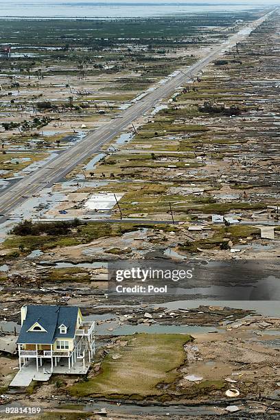 Home is left standing among debris from Hurricane Ike September 14, 2008 in Gilchrist, Texas. Floodwaters from Hurricane Ike are reportedly as high...