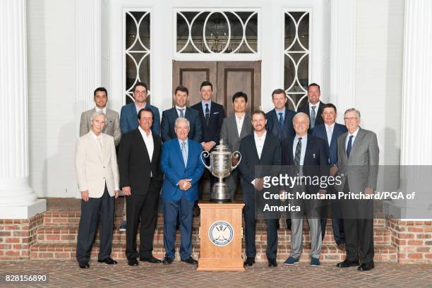 Past Champions gather for a photo with the Wanamaker trophy during the ChampionÕs Dinner for the 99th PGA Championship held at Quail Hollow Club on...