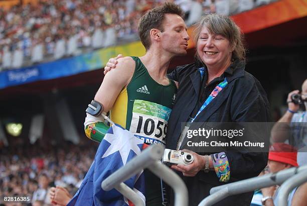 Heath Francis kisses his mother after running in the men's 100M final athletics event at the National Stadium during day nine of the 2008 Paralympic...