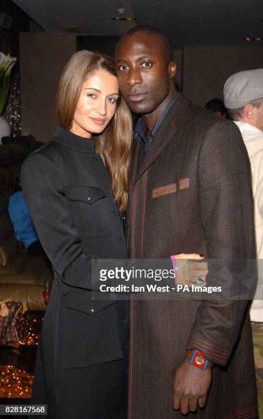Ozwald Boateng and his wife arrive at the launch party for The Absolut Ice Bar, the UK's first icebar where temperatures are kept at a steady -5...