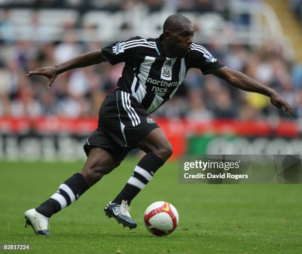 Geremi of Newcastle United running with the ball during the Barclays Premier League match between Newcastle United and Hull City at St. James's Park...