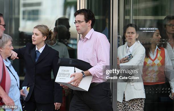 Man leaves Lehman Brothers' Canary Wharf office on September 15, 2008 in London, England. The fourth largest American investment bank has announced...