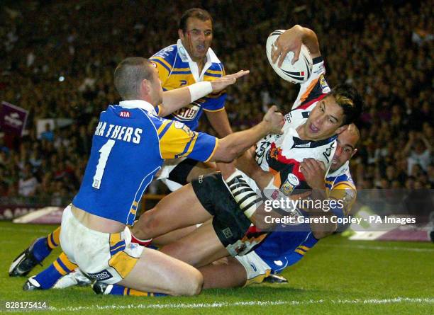 Bradford Bulls's Shontayne Hape gets past Leeds Rhinos's Richie Mathers and Chev Walker to cross for a try which was disallowed