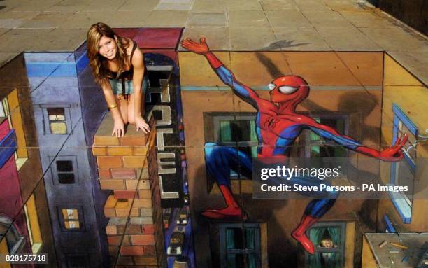 Ex-Coronation Street star Nikki Sanderson is stranded in street artist Julian Beever's 3-D cityscape at the launch of the Ultimate Spider-Man comic...