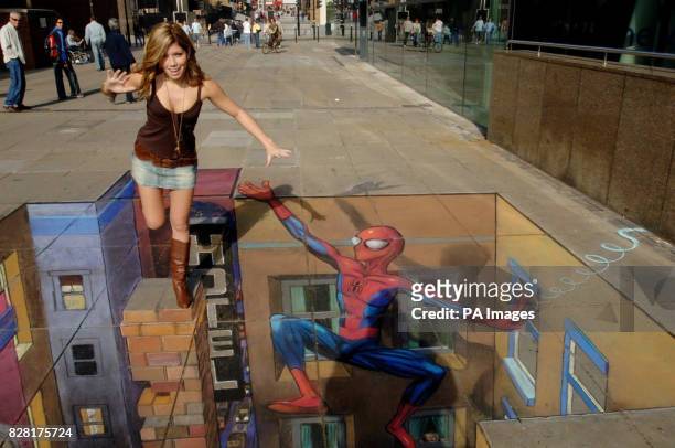 Ex-Coronation Street star Nikki Sanderson is stranded in street artist Julian Beever's 3-D cityscape at the launch of the Ultimate Spider-Man comic...